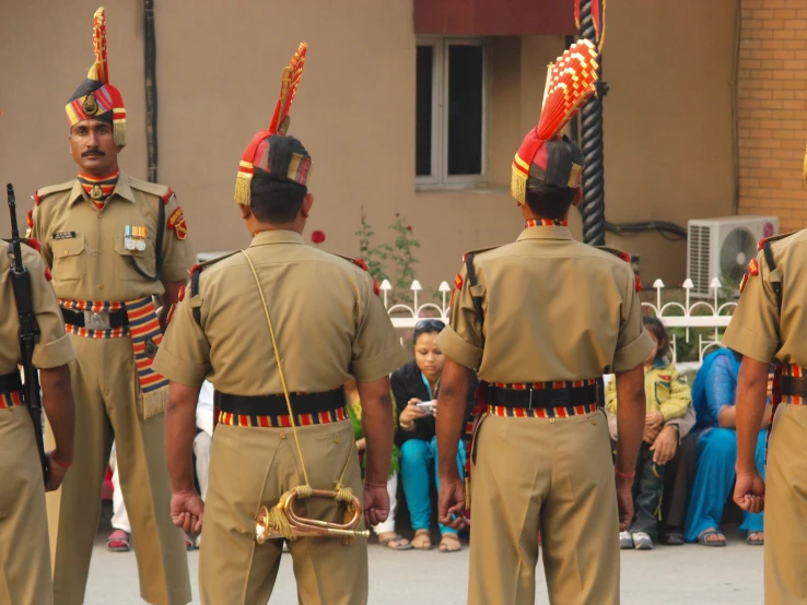 a couple of soldiers that are standing next to each other