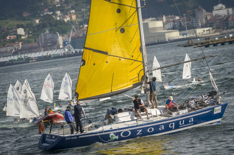 several people sailing on a small boat in the ocean