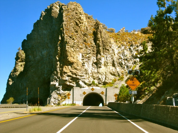 an exit for a tunnel near a big mountain