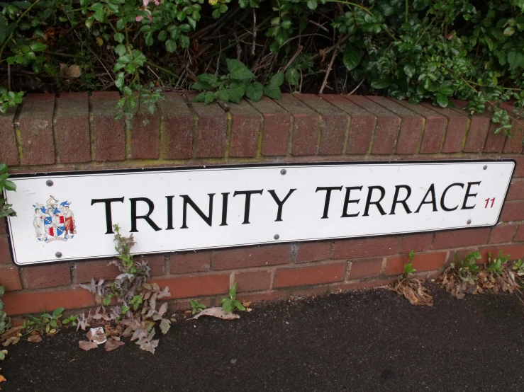 there is a sign that says trinity terrace on the wall