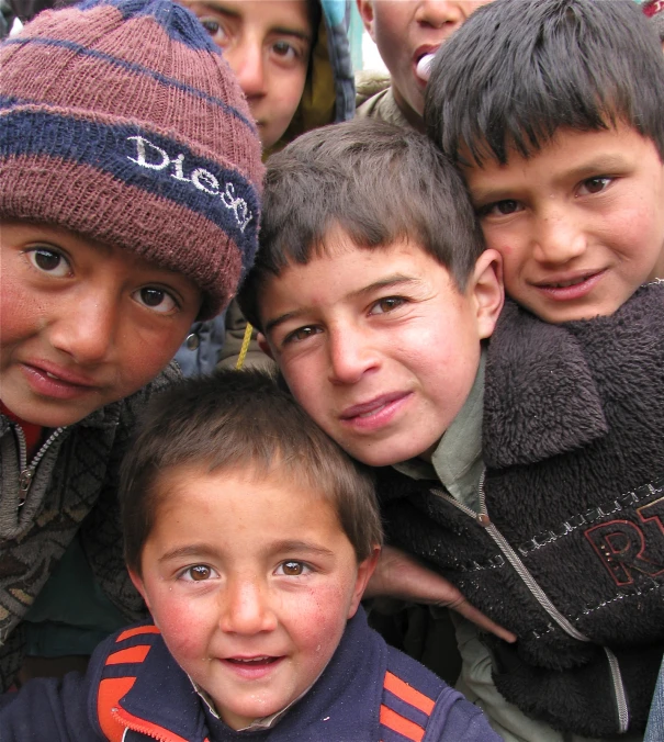 a group of young children posing for a pograph