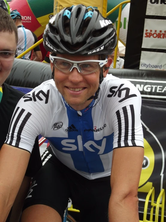 a man is posing for a po in his bicycle gear