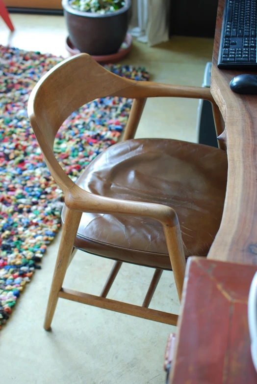 a chair and desk with a computer on it