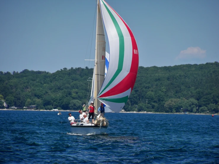 a large multi colored boat traveling across the ocean