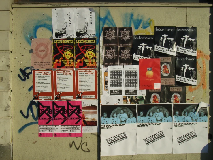 various posters and stickers adorn the back wall