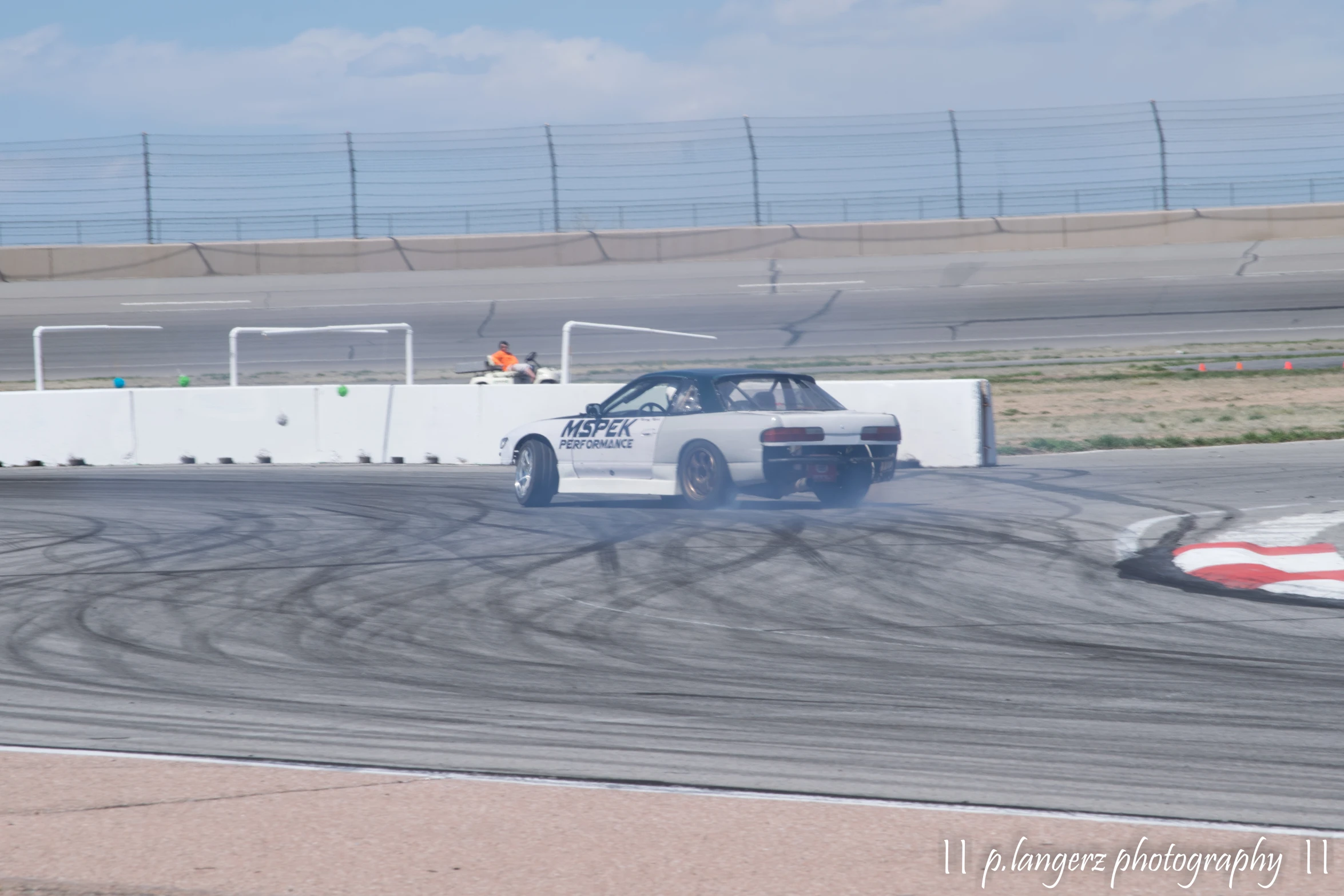 a car races on an obstacle track during a race