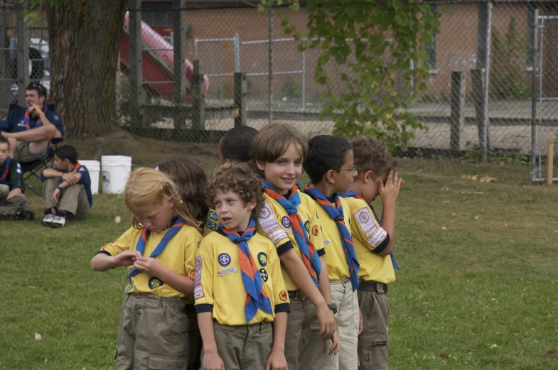 small children are in uniform standing together
