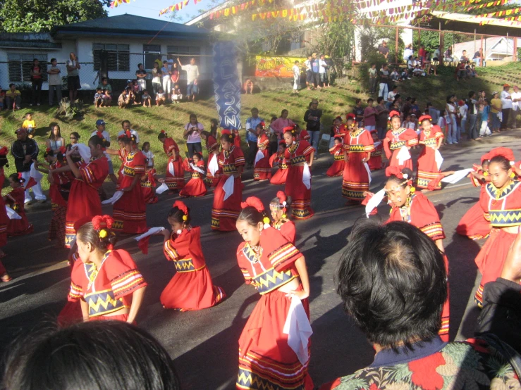 several dancers and spectators on the street