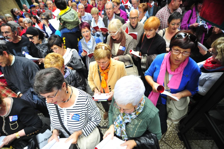 a large group of people standing together in a line