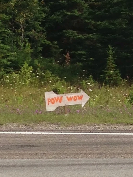 a sign on the side of the road saying pow wow