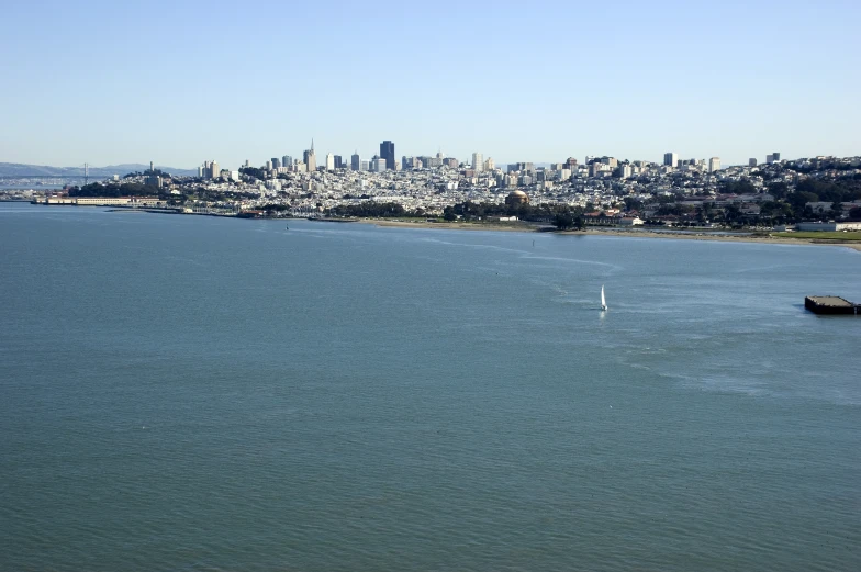 view of the ocean and city from a bridge