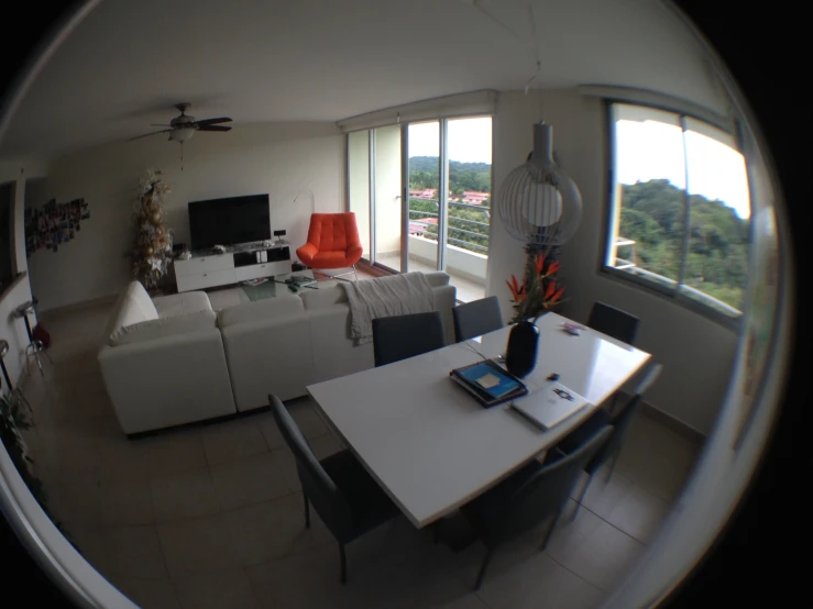 a panoramic view of living room with couches