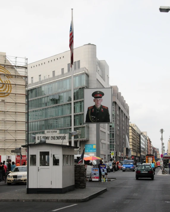 a street corner with a building and a billboard on it