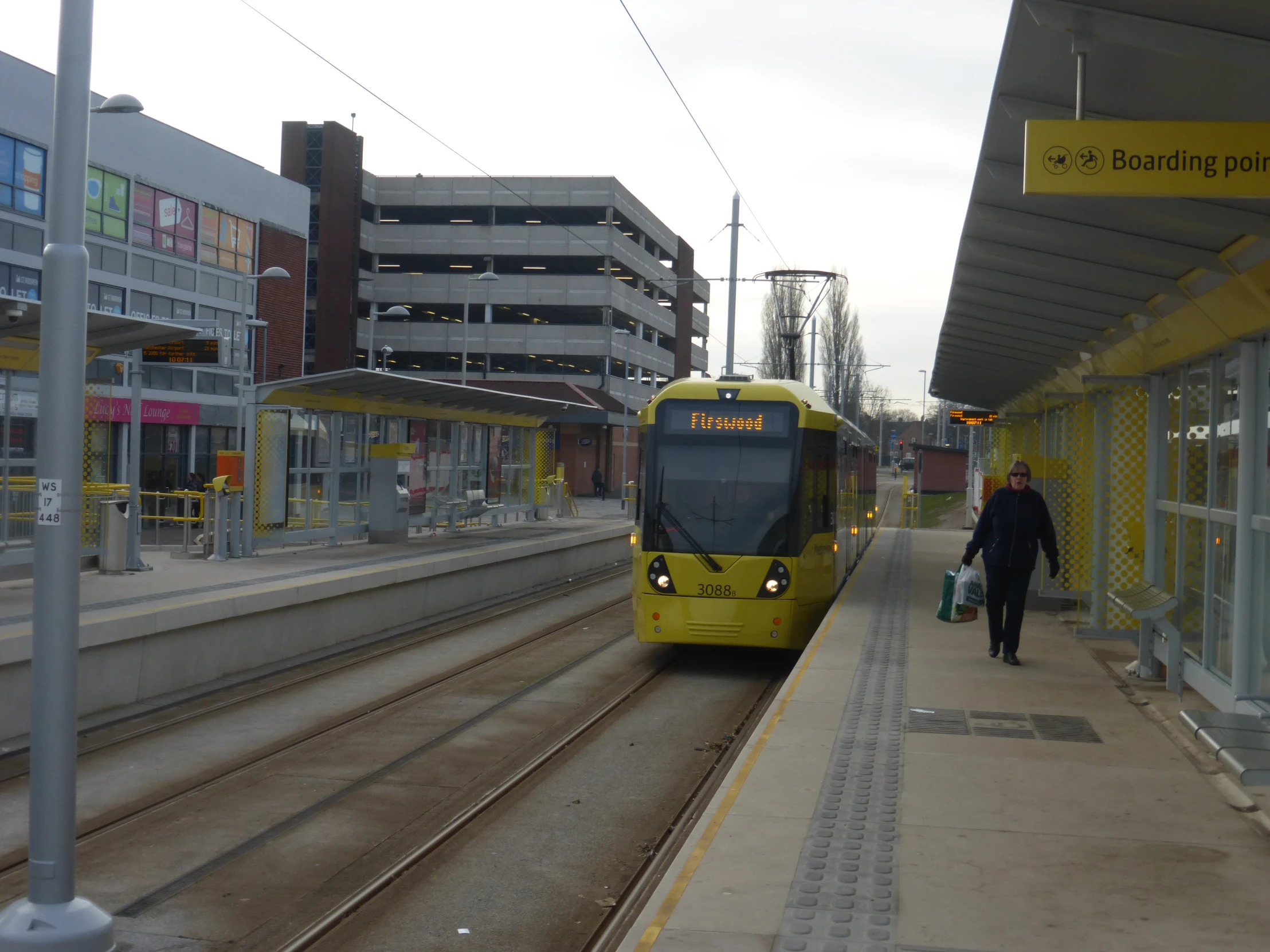 a man walking toward a train station