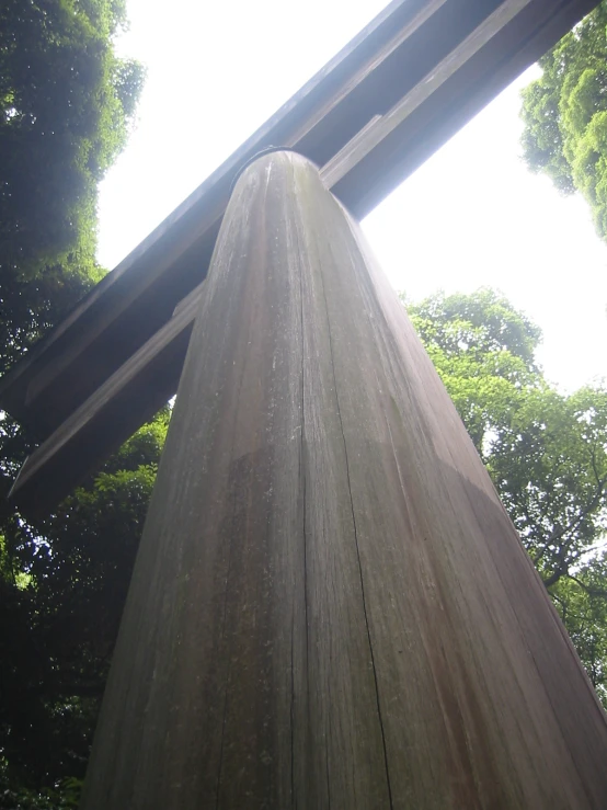 a wooden structure is next to several trees