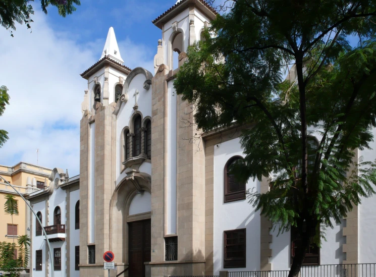 a church with steeples stands out from the street