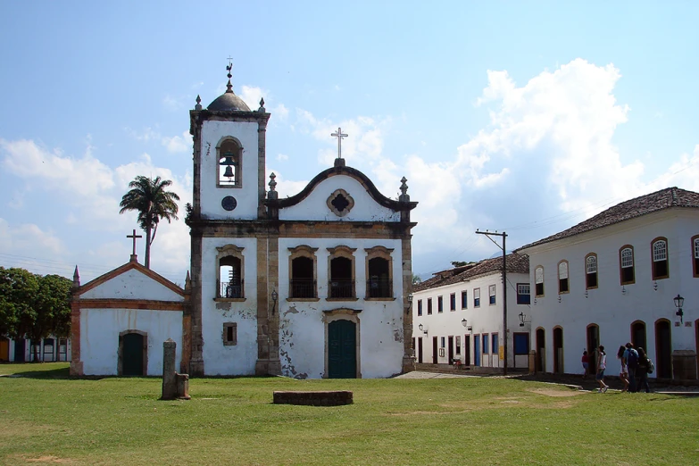 an image of an old building on the grass