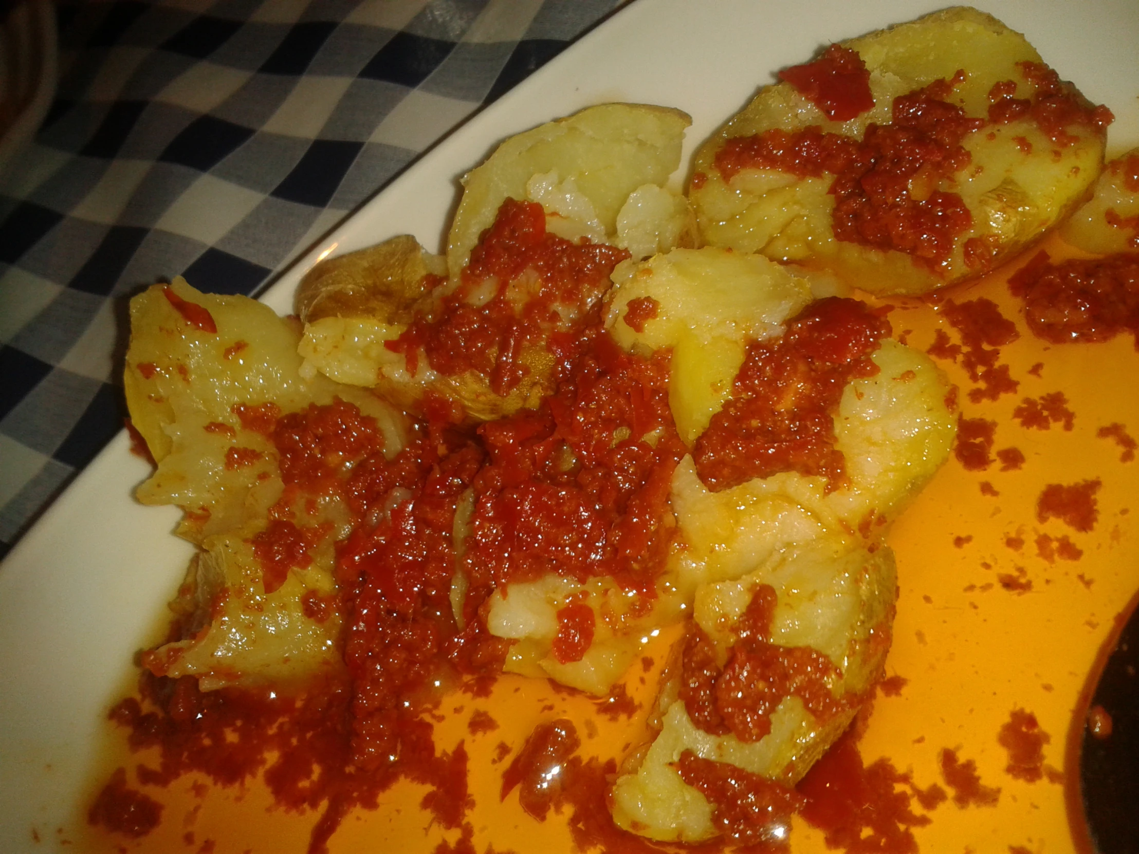 this plate contains ravioli, marinara and fried cheese