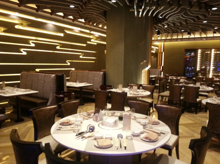 the dining area of a large restaurant is dimly lit