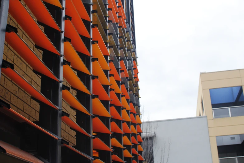 a large building with orange cones on the side of it