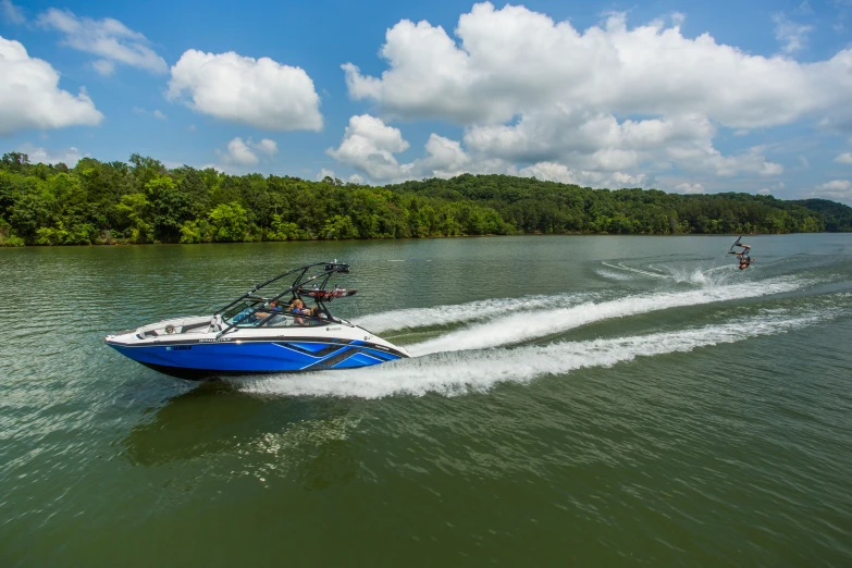 two boats speeding in the water