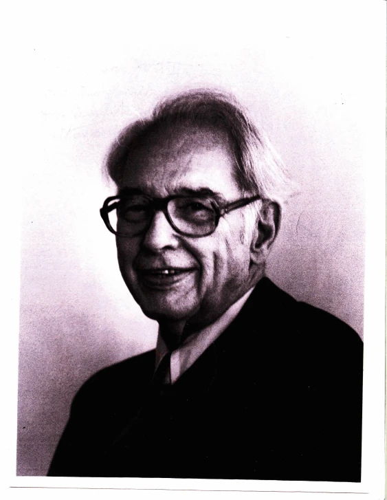 a black and white portrait of a man in glasses