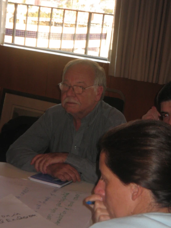 a man and a woman sitting at a table