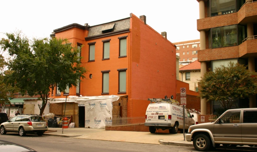 a large red brick building on the street