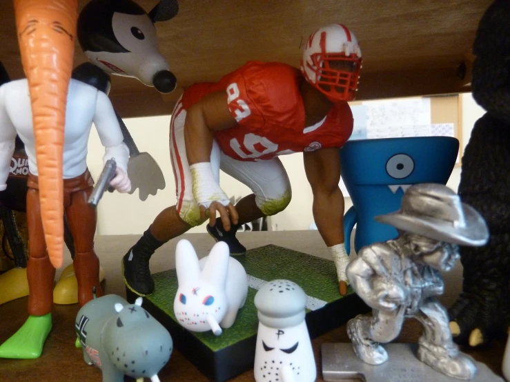 a group of toy animals in the shape of football