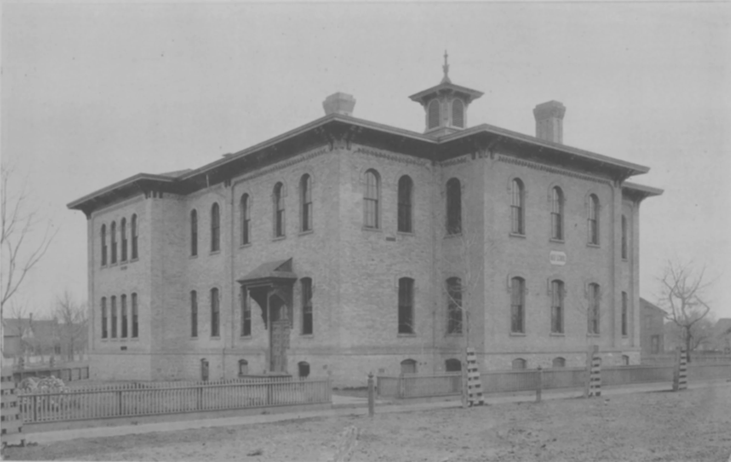 an old brick building that is standing in the dirt