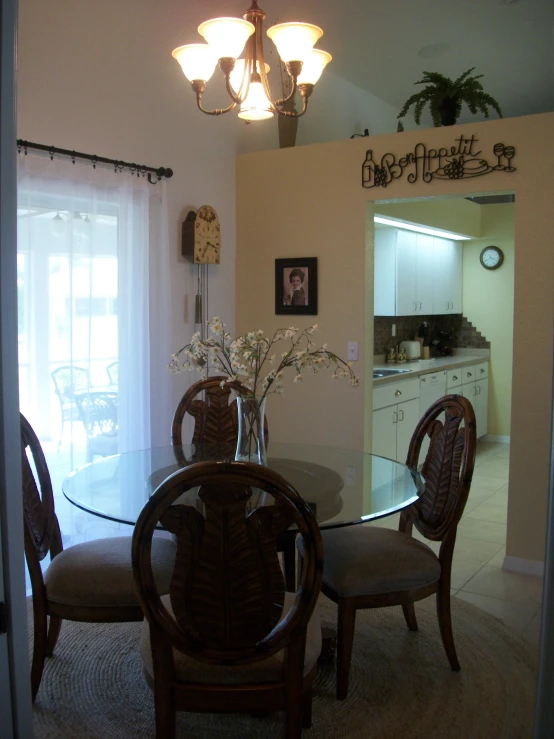 dining room with a glass table and chairs