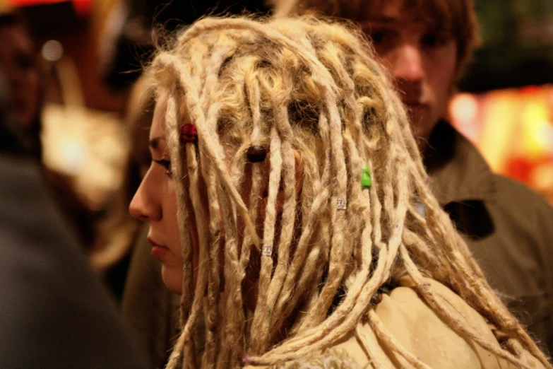 a woman with dreadlocks in the street