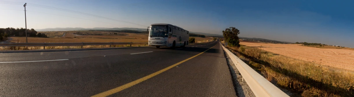 a bus that is on a rural road