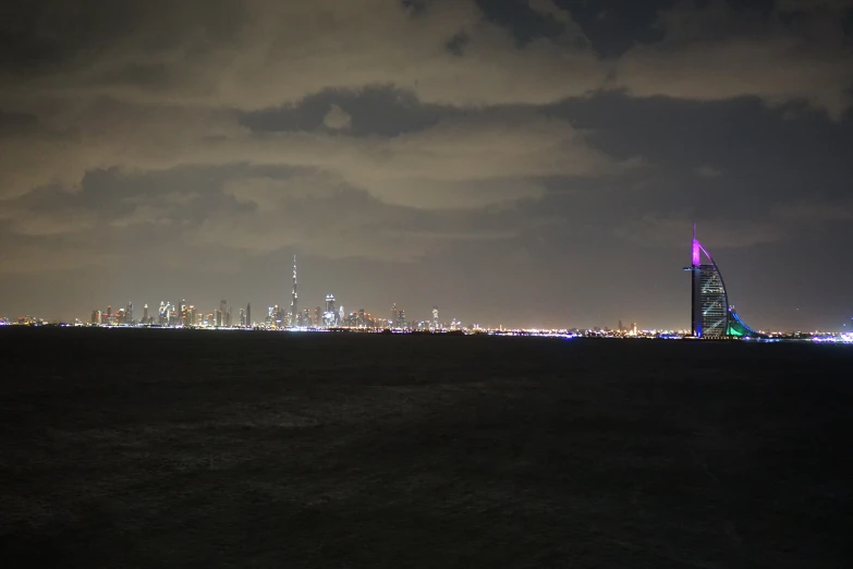 a city skyline lit up in the night sky