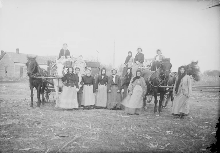 a group of people sitting on top of horses