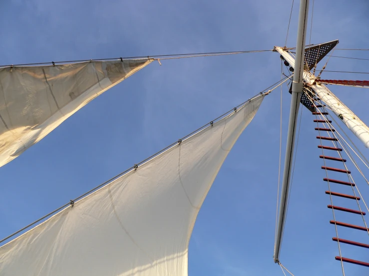 the rig of a sailing vessel and a rope railing