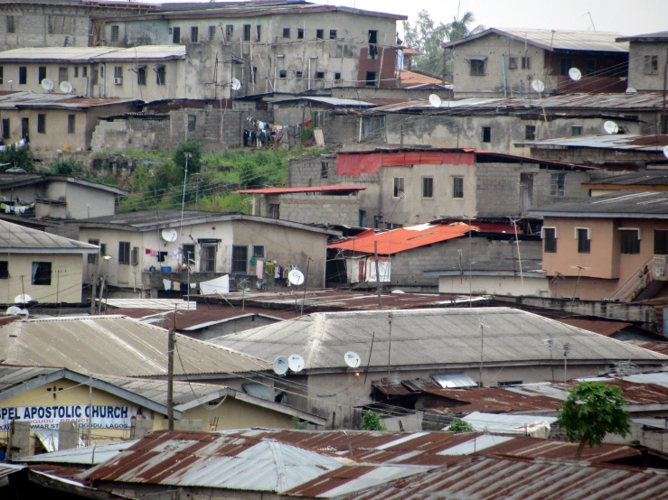 a bunch of small buildings sitting in the mountains