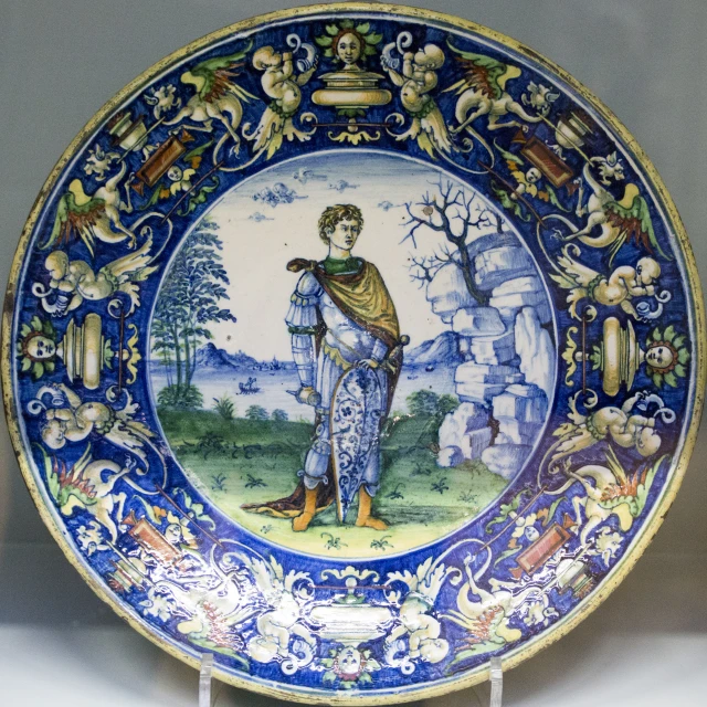 a close - up of a decorative plate with figures