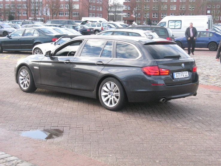 a car parked in a parking lot near other cars