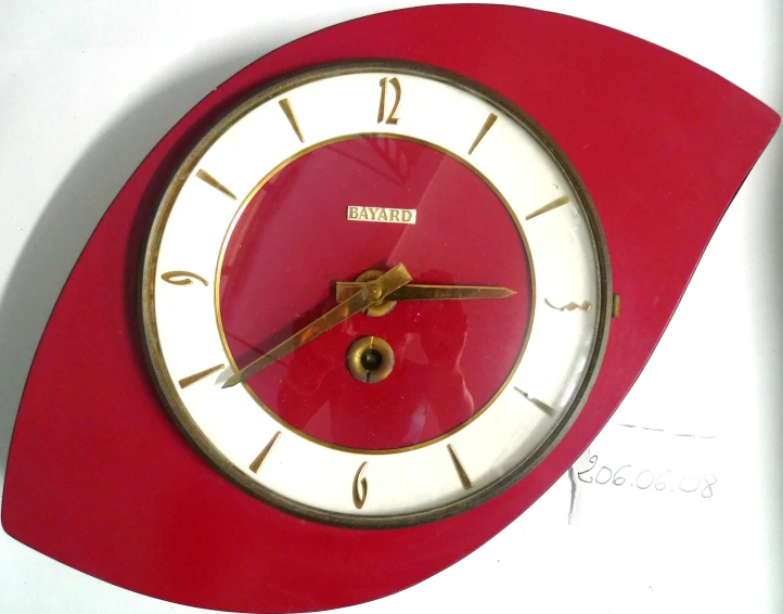 an analog clock with no hands, showing the time in red