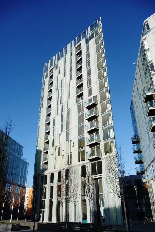 a tall building is shown from the ground