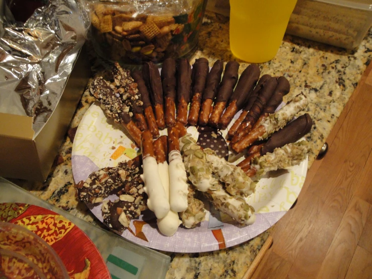 there is a plate with candy and pretzels on it