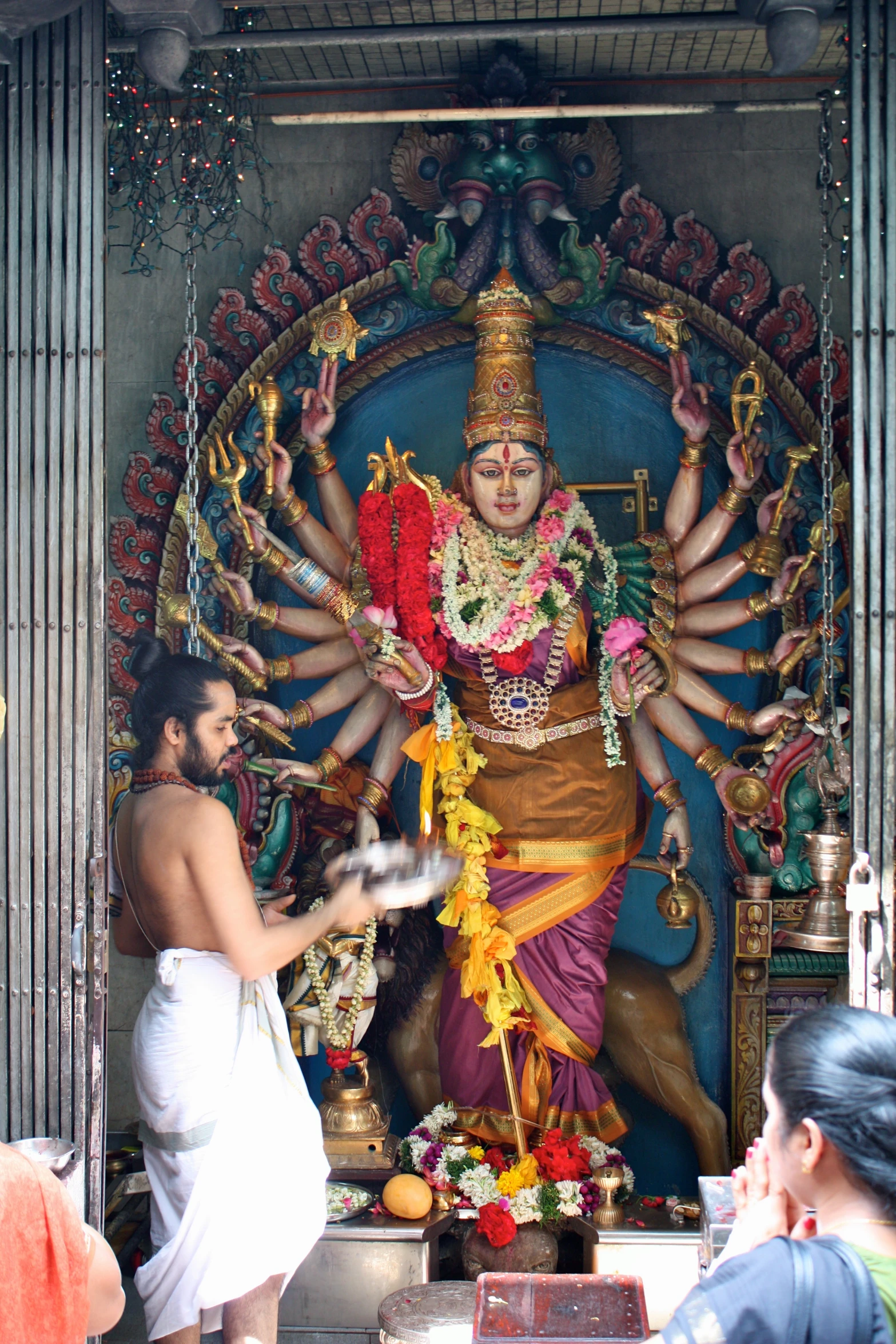 some very big pretty statues inside of a big building