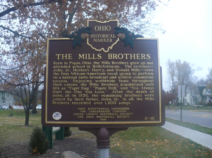 the sign on the roadside telling the history of the mills brothers