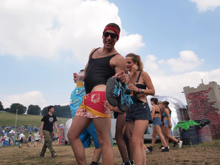 a couple are standing in the middle of the festival