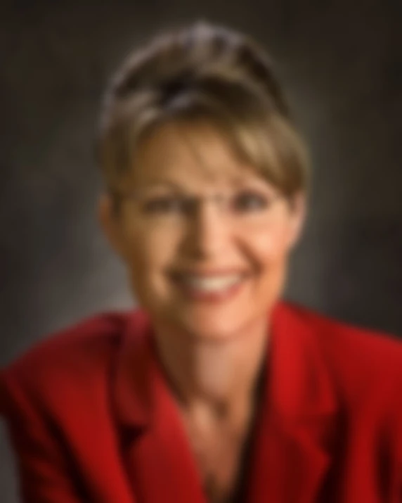 a woman in a red suit posing for a picture