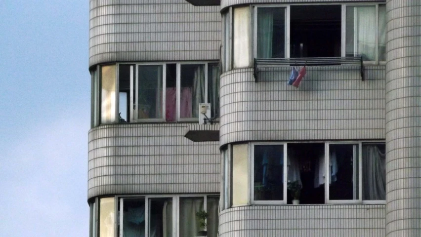 a white and gray building with many windows