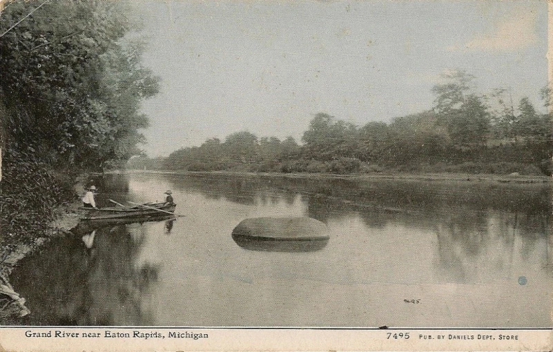 there is a boat on the river with people in it