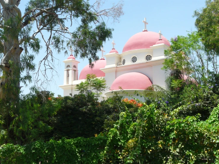 a large building with domes and crosses on top of it