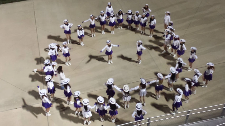 an aerial view of girls'cheer team and their coaches